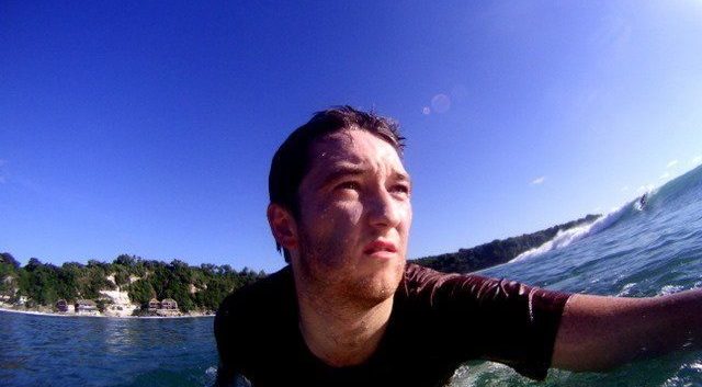 surfer on board paddling capture by gopro