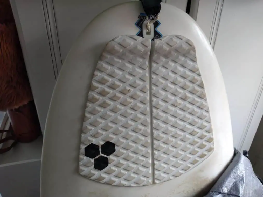tail of surfboard with a traction pad on it