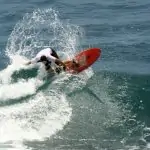 Me on my first day surfing at Uluwatu, trying to do a turn off the top.