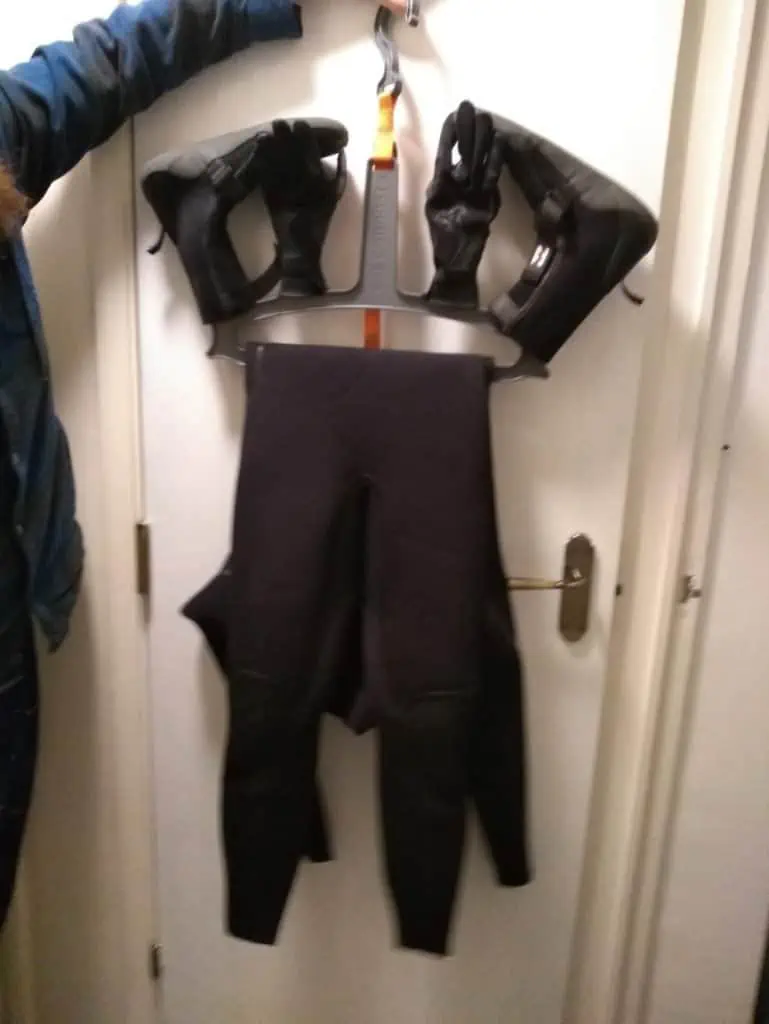 wetsuit hanger with all accessories on it