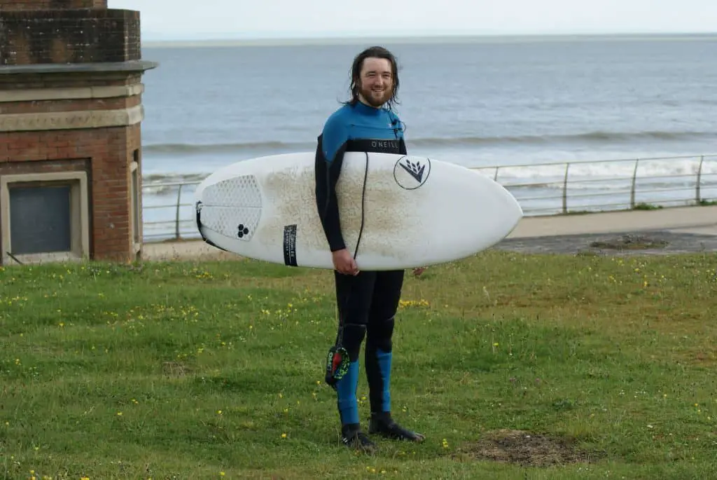 surfer with blue Oneill chest zip wetsuit