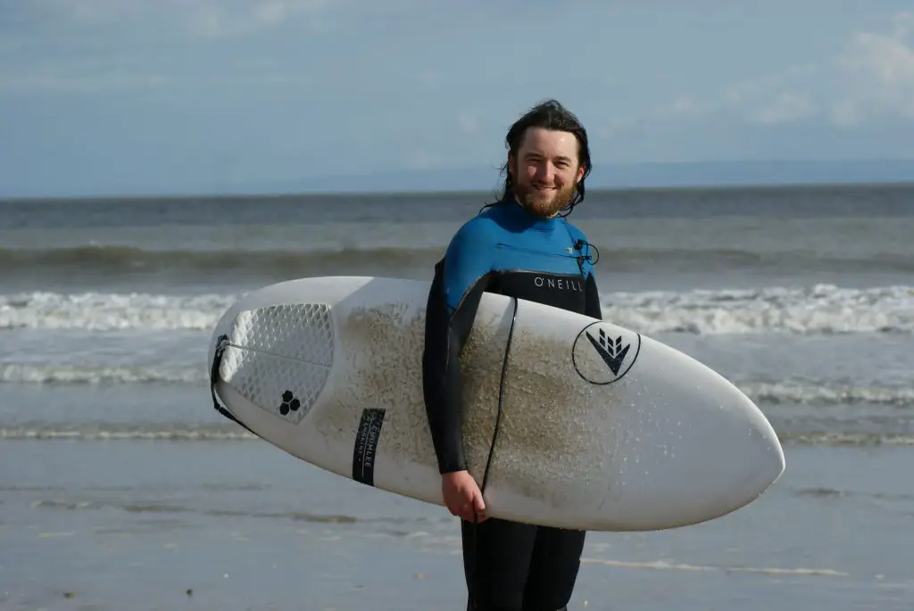 surfer with blue Oneill chest zip wetsuit