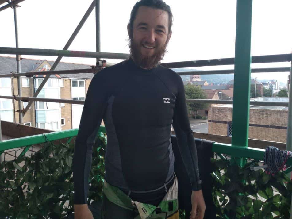 surfer wearing a wetsuit top