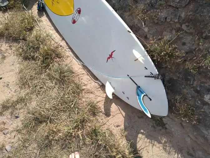surfboard fins on a mid-length surfboard